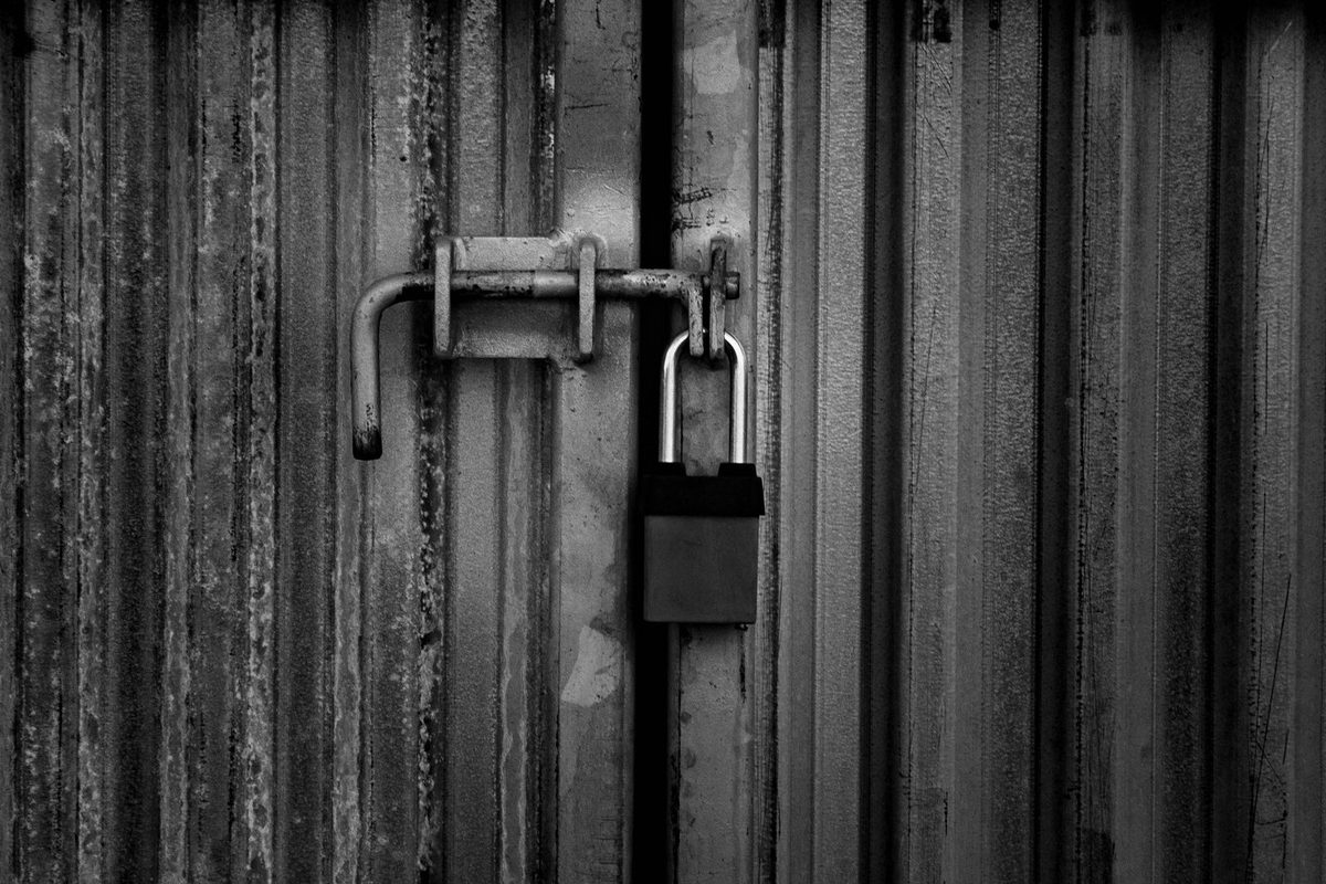 High-Security Lock Upgrade — Heavy-duty padlock on a steel gate