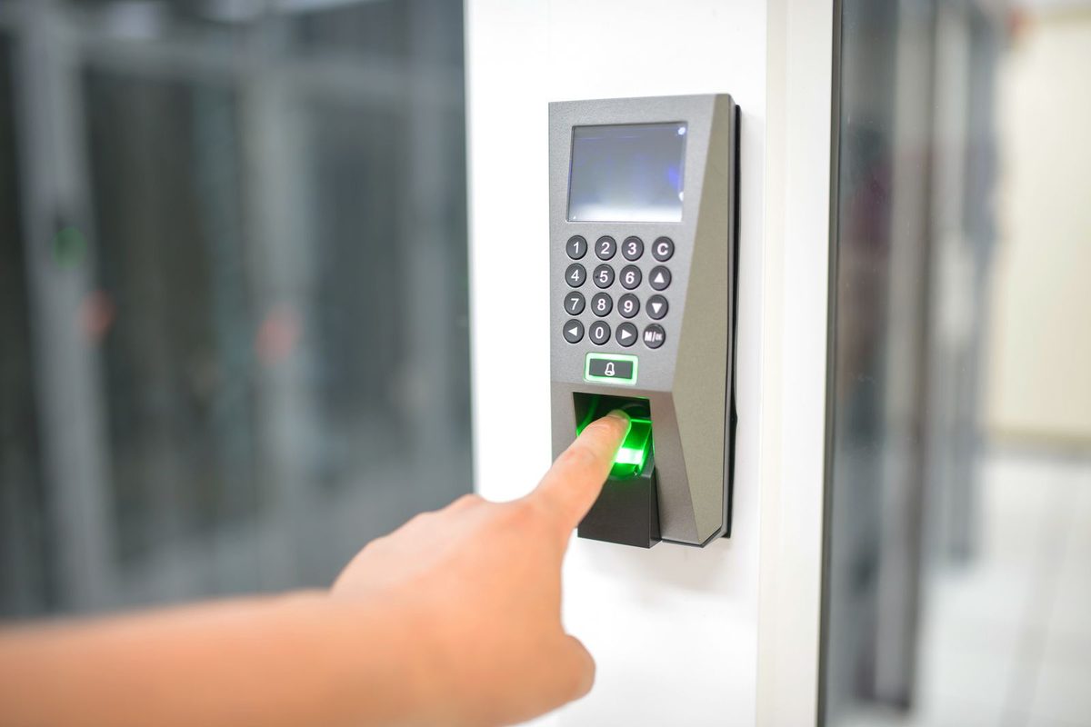 Smart Lock Installation — Keypad access control unit on a door being used